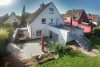 Modernisiert & freistehend: Familienfreundliches Einfamilienhaus in Essen Huttrop - Rückansicht auf die Terrassen